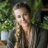 Emma Green, indoor plant expert with green plants background